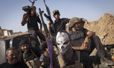 Shia militia members patrol south of Kirkuk