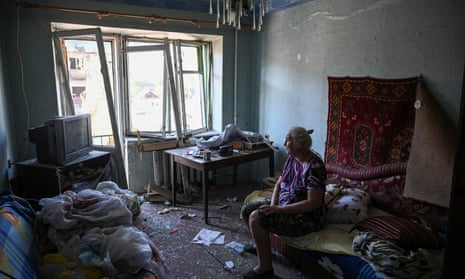 Lydia, 75, sits in her destroyed flat, at a residential building destroyed during a Russian missile strike