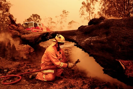 Fire crews put out spot fires in Sarsfield, Australia, in 2020