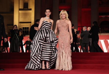 Anne Hathaway and Donatella Versace on the red carpet in their gowns