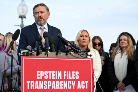 A man speaks at a lectern with a sign saying 'Epstein Files Transparency Act'