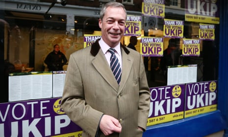 Nigel Farage poses for photographs outside the Ukip office in 2014.