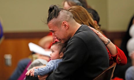Savanna LaFontaine-Greywind’s boyfriend Ashston Matheny holds their daughter, as victim impact statements are read during the sentencing of Brooke Crews.