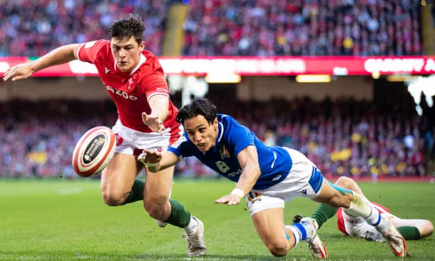 Louis Rees-Zammit beats Ange Capuozzo to the ball during Wales’ Six Nations defeat to Italy.