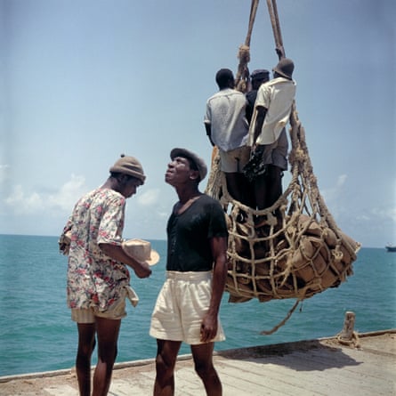 Loading people and goods at Lomé harbor in Togoland (now Togo).