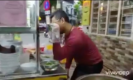 Screengrab of noodle seller Peter Lam Bui performing an impression of Salt Bae in a video he posted online
