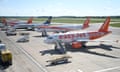 EasyJet and Ryanair aircraft are parked at Luton Airport