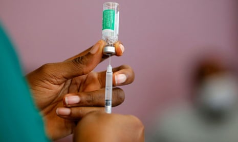A nurse prepares a dose of the Covid vaccine in Ghana