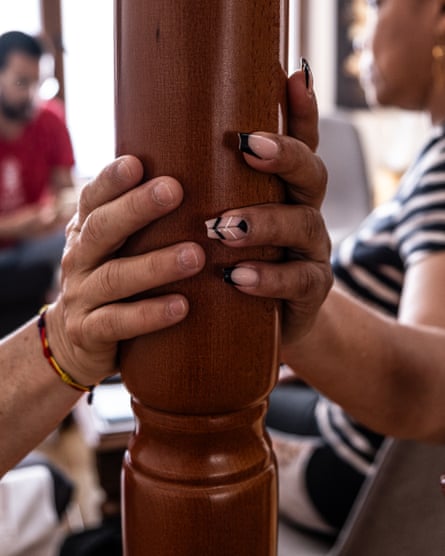 two people holding a banister