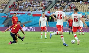 Spain’s Gerard Moreno shoots before Alvaro Morata scores their first goal.