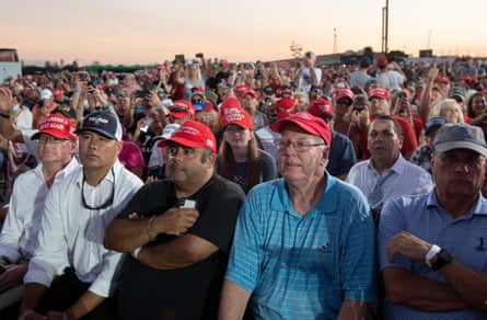 Attendees listen to Donald Trump speak at his campaign rally in Sanford, Florida.