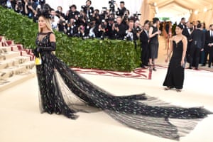 Rita Ora made a dramatic entrance at the Met Gala wearing a sweeping black Prada gown