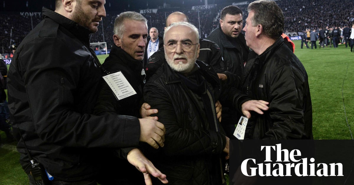 Greek football match stopped after team owner invades pitch with a gun