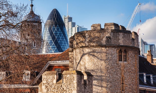 The Tower of London overlooked by 30 St Mary Axe, AKA the Gherkin.