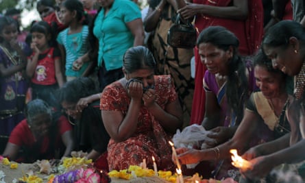 Tamil women at the grave of their relatives