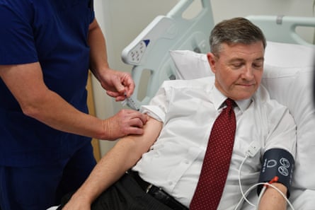 Prof Guy Ludbrook injects Ian Tindall with the Covax-19 vaccine during trials at the Royal Adelaide hospital in July 2, 2020.