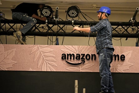 Workers near Amazon Prime branding in Mumbai, India, on September.