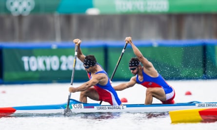 Serguey Torres and Fernando Dayan Jorge Enriquez of Cuba power through the water at the Tokyo Olympics in 2021.