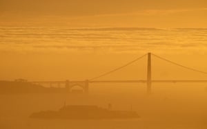 San Francisco, US: Fog blankets the Golden Gate bridge and Alcatraz Island at sunset