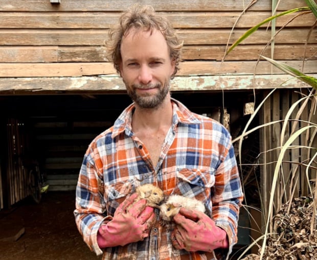 ‘We thought all the animals were dead.’ Adam Guise with the guinea pigs that survived the flooding.