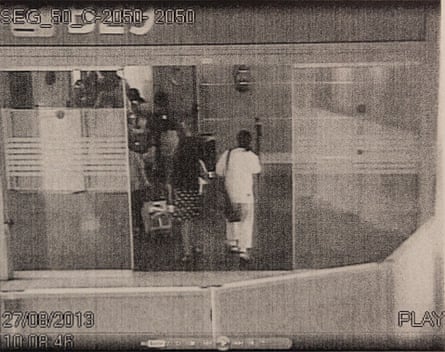 Grainy security camera footage from Barajas airport shows Nada and Morales queueing to board a plane.