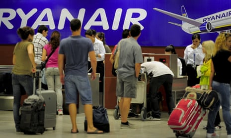 Ryanair passengers check in their bags