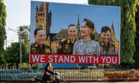 A huge billboard depicting Aung San Su Kyi with three military ministers displayed along a main road in Karen state, Myanmar.
