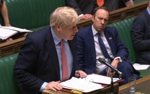 Matt Hancock watching Boris Johnson speaking during Prime Minister’s Questions, 25 March prior to the announcement on the 27 March that both he and the and Health Secretary had tested positive for coronavirus