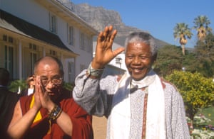 The Dalai Lama meets South African anti-apartheid activist and former president Nelson Mandela in 2004.