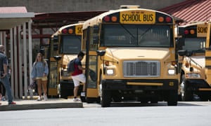 Cherokee high school buses leave school with students at end of first week of in-person fall classes.