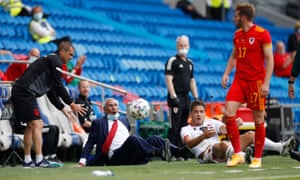 Albania coach Edoardo Reja and Bekim Balaj react after being pushed over by Wales’ Rhys Norrington-Davies.
