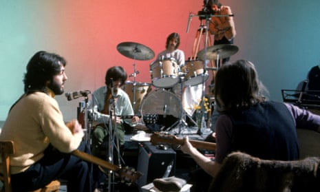 The Beatles being filmed for the 1970 documentary Let It Be.