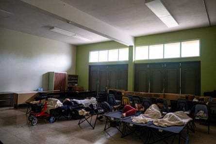 People affected by Hurricane Fiona rest at a shelter in Salinas, Puerto Rico.