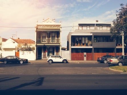 A Melbourne suburb street scene with houses and a few cars.