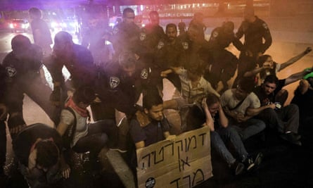 Israeli police detain demonstrators in Tel Aviv.