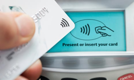 a credit card touches a payment terminal