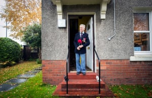 Bomber command veteran Alastair Lamb, 95, observes a two-minute silence at 11am on Remembrance Sunday from his doorstep at his home in Stirling