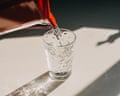 Pitcher pouring water in a glass