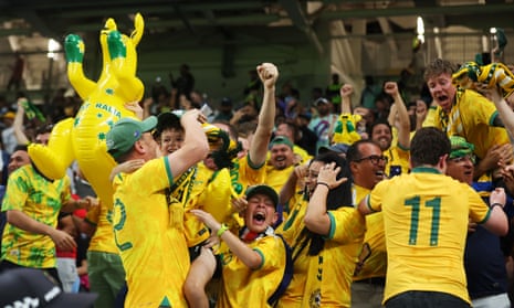 Australia fans celebrate as they proceed to the knock out stages.