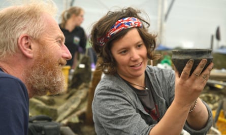 Archaeologists examines a bronze age bowl