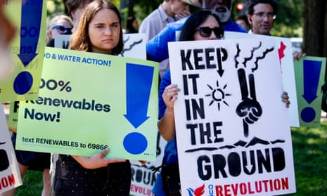 Activists in Washington DC demand an end to fossil fuel subsidies on 29 July. Progressives are calling on the Biden administration to use the infrastructure bills to dramatically transform the US energy sector. 