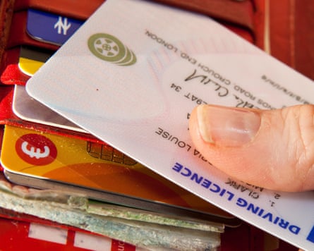 A person removing a driving licence from a purse