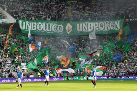 Celtic fans unveil a banner reading "unbowed, unbroken" during the Cinch Scottish Premiership match between Celtic and Rangers at Celtic Park.