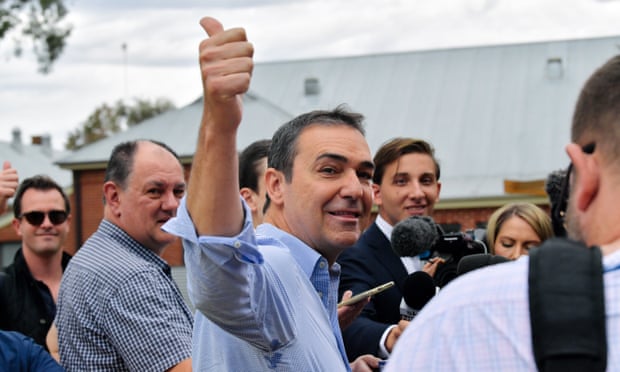 South Australia’s Liberal Leader Steven Marshall gives a thumbs up to a voter at a polling station in Adelaide