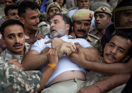 Indian opposition leader Rahul Gandhi is detained by police in Delhi on Tuesday.