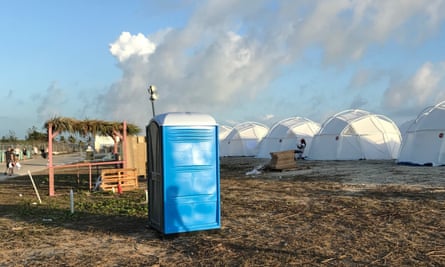 tents and a portable toilet set up for attendees for the Fyre Festival