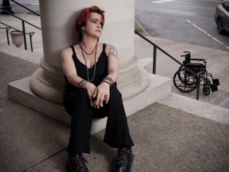 Linda Tirado sits on column in all black