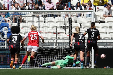 Daphne van Domselaar of Arsenal saves a penalty from Wendie Renard of OL Lyonnes.