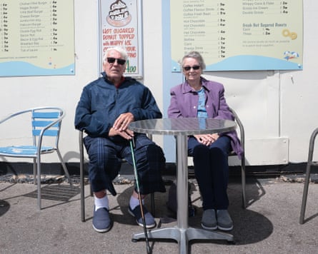 Ray and Heather Craddock sitting at a small outdoor table