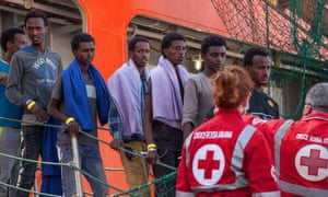 Migrants arrive in Palmero after being rescued by a Norwegian ship in the Mediterranean.
